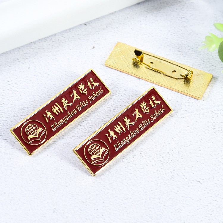 天津学校胸牌多少钱一枚，厂家定做合金材质校徽胸牌定制