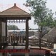 朝陽陽臺庭院綠化設(shè)計碳化木涼亭圖