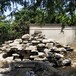 泰州驳岸塑石定做_泰州花园假山鱼池质量