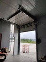 成都消防工业滑升门厂房电动保温提升门仓库上滑式翻板门